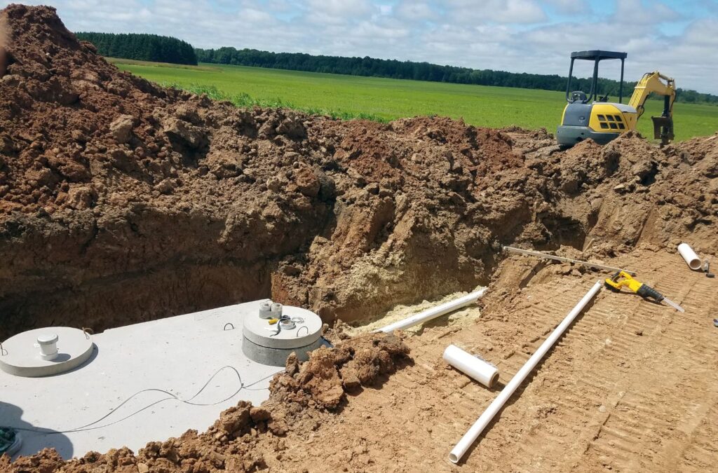 A professional team from Painter Land Development installing a septic tank in Upstate, South Carolina, showcasing their expertise and dedication