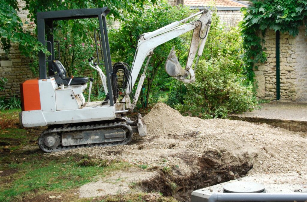 Experienced crew from Painter Land Development working on a septic tank in Walhalla, SC, demonstrating top-tier service. Septic Tank Installation and Repair Near Me.