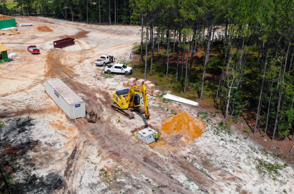 A team working on land preparation for a building project. Land Grading & Excavation Near Me.